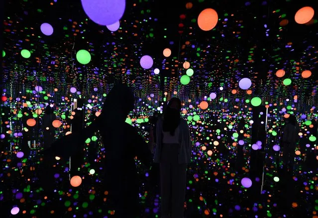 Visitors visit an art installation by Japanese artist Yayoi Kusama entitled “Infinity Mirrored Room – Brilliance of the Souls” at the Museum MACAN (Modern and Contemporary Art Museum) in Jakarta on June 30, 2022. (Photo by Adek Berry/AFP Photo)