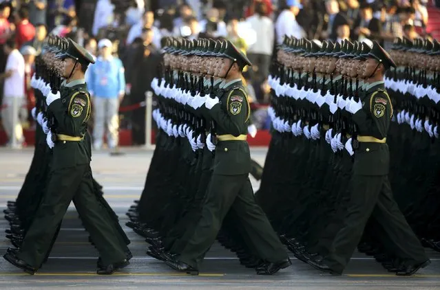 Soldiers of China's People's Liberation Army (PLA) prepare in front of the Tiananmen Gate ahead of the military parade to mark the 70th anniversary of the end of World War Two, in Beijing, China, September 3, 2015. (Photo by Jason Lee/Reuters)