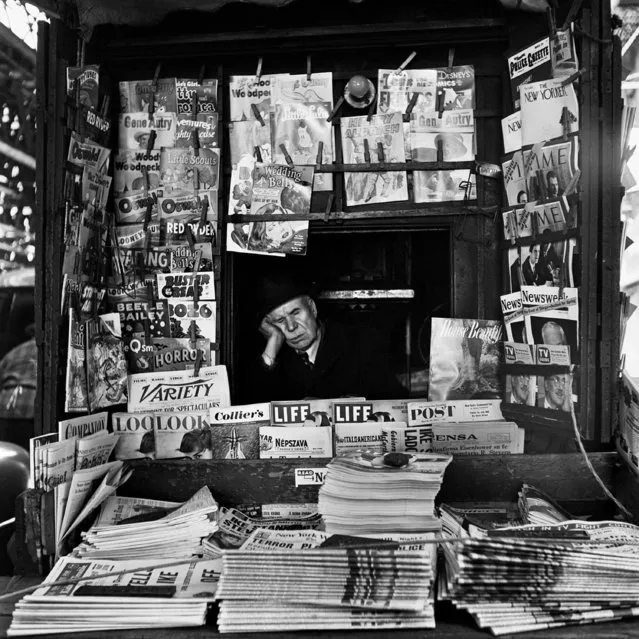 This 1954 photo provided by the Estate of Vivian Maier and John Maloof Collection shows a newsstand vendor in New York. (Photo by Vivian Maier/Estate of Vivian Maier and John Maloof Collection via AP Photo)
