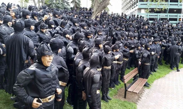 542 employees of the Nexen Energy company gather in a park in Calgary, Alberta to set a new Guinness world record for the Largest Gathering of People Dressed as Batman in this September 18, 2014 handout photo by Bill Cubitt. The gathering kicked off a campaign for a United Way charity. (Photo by Bill Cubitt/Reuters)