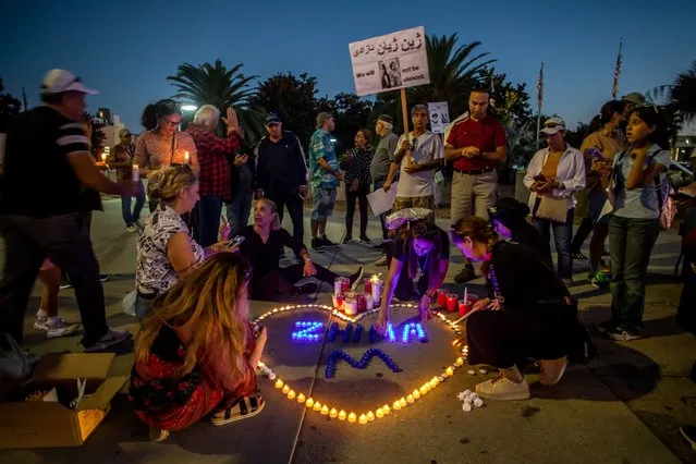 Californian Kurds hold a demonstration and candlelight vigil to honor the memory of Mahsa Zhina Amini in front of the Federal Building on September 22, 2022 in Los Angeles, California. Amini died after being arrested in Tehran by the Islamic Republic's morality police on September 16th. (Photo by Apu Gomes/Getty Images)