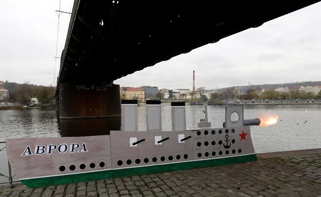 A mock-up cruiser Aurora, which fired the shot that announced the start of Russia's 1917 Bolshevik Revolution, is seen on the Vltava river bank during a protest rally organized by activist group “Without communists” to mark the Red October revolution's centenary in Prague, Czech Republic on November 7, 2017. (Photo by David W. Cerny/Reuters)