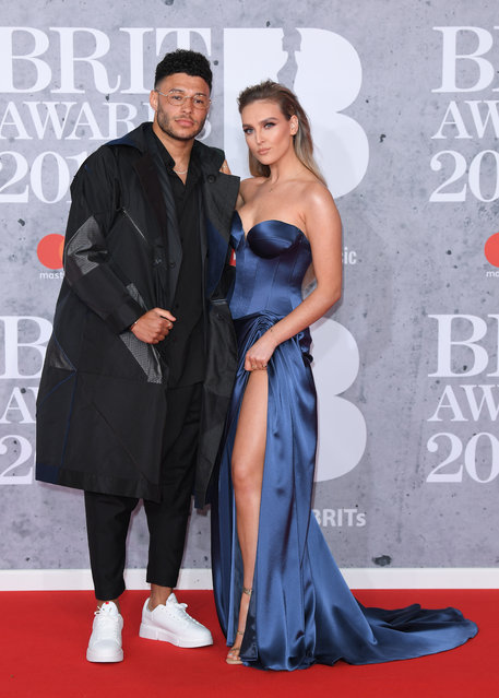 English professional footballer Alex Oxlade-Chamberlain and English singer Perrie Edwards attend The BRIT Awards 2019 held at The O2 Arena on February 20, 2019 in London, England. (Photo by Karwai Tang/WireImage)