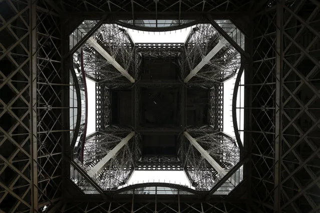 A bottom view of the new 1st floor of the Eiffel Tower in Paris, France, October 6, 2014. The first floor of the iconic landmark was renovated and reopened. (Photo by Yoan Valat/EPA)