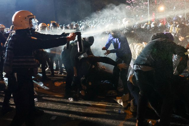 Men help demonstrators as police officers use pepper spray during a protest against the arrest of Istanbul Mayor Ekrem Imamoglu as part of a corruption investigation, in Istanbul, Turkey, on March 24, 2025. (Photo by Murad Sezer/Reuters)