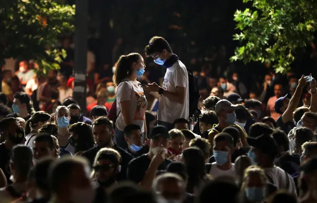 People attend a rally against the government's lockdown measures, amid the spread of the coronavirus disease (COVID-19), in front of the parliament in Belgrade, Serbia, July 9, 2020. (Photo by Marko Djurica/Reuters)