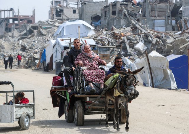 An old woman reacts as Palestinians make their way to flee their homes, after the Israeli army issued evacuation orders, in Jabalia, in the northern Gaza Strip on March 25, 2025. (Photo by Mahmoud Issa/Reuters)