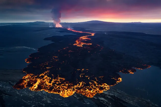 “Volcanic Sunset”. Earlier this year I was fortunate enough to shoot the Holuhraun volcanic eruption. After several days waiting for good flying weather, I got my OK and went on the helicopter. I was incredibly lucky to have both a spectacular pink sunset and a new, red-hot lava formation in the foreground. (Photo and caption by Erez Marom/National Geographic Photo Contest)