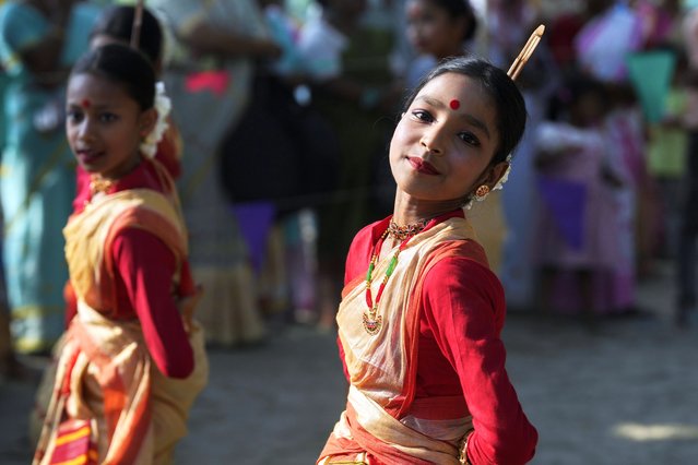 Assamese girls in traditional attire dance during the Gohain Uliuwa Mela festival in Mayong village on the outskirts of Guwahati, India, Saturday, April 19, 2025. (Photo by Anupam Nath/AP Photo)