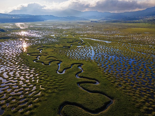 An aerial view of the meanders of the Sakarya River located at the Karagol Plateau, that surrounded by pine, beech, fir and oak trees, in Tarakli district of Sakarya, Turkiye on April 06, 2025. The water-filled meanders on the plateau create a beautiful view with the arrival of spring and the revival of nature. The river, which originates in Central Anatolia and reaches the Black Sea, plays a critical role for both ecosystems and people. (Photo by Seyit Konyali/Anadolu via Getty Images)