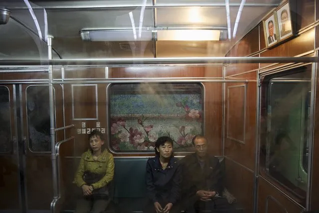 Passengers travel on a train that stopped at a subway station visited by foreign reporters during a government organised tour in Pyongyang, North Korea, October 9, 2015. (Photo by Damir Sagolj/Reuters)