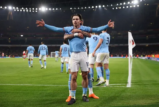Jack Grealish of Manchester City celebrates after scoring the team's second goal with teammates during the Premier League match between Arsenal FC and Manchester City at Emirates Stadium on February 15, 2023 in London, England. (Photo by Julian Finney/Getty Images)