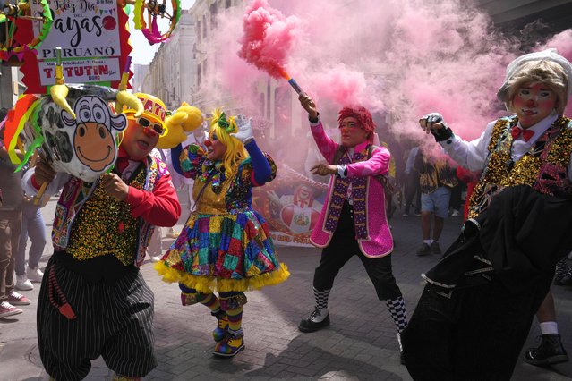 Clowns celebrate The Day of the Peruvian Clown in downtown Lima, Peru, Saturday, May 25, 2024. (Photo by Martin Mejia/AP Photo)