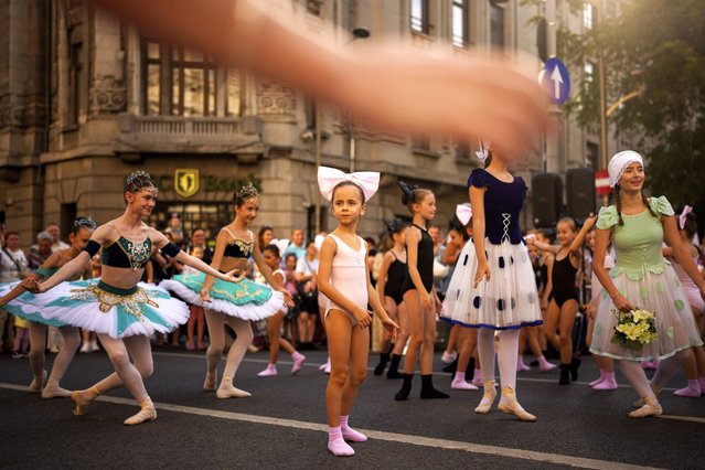 Children of the Romanian National Opera's Ballet Studio outside the National History Museum of Romania during Dance Night, an event featuring a wide variety of dance styles performed on the Calea Victoriei avenue in Bucharest, Romania, Saturday, August 23, 2025. (Photo by Andreea Alexandru/AP Photo)