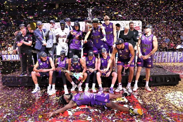 The Sydney Kings pose with the Dr John Raschke trophy after winning game five of the NBL Grand Final series between Sydney Kings and New Zealand Breakers at Qudos Bank Arena on March 15, 2023, in Sydney, Australia. (Photo by Mark Metcalfe/Getty Images)