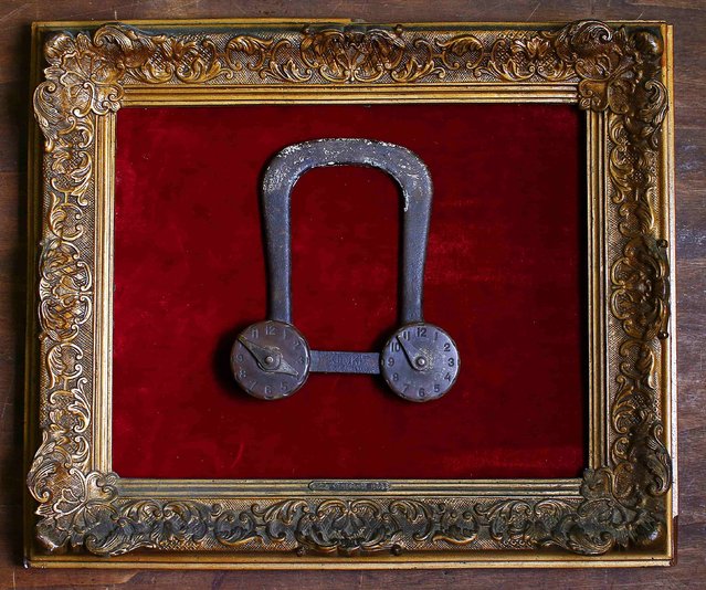 A 19th century bicycle safety lock is displayed in an old frame in the Museum of Domenico Agostinelli in Dragona, near Rome October 30, 2014. (Photo by Tony Gentile/Reuters)