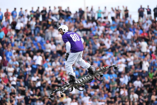 A Fiorentina fan flies with a drone inside the Artemio Franchi stadium in Florence, Italy, April 29, 2018, before the Italian Serie A football match between Fiorentina and Napoli. (Photo by Alberto Lingria/Reuters)