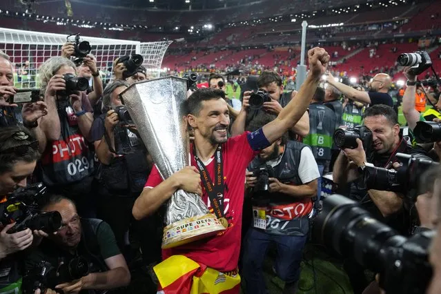 Sevilla's Jesus Navas carries the trophy after winning the Europa League final soccer match between Sevilla and Roma, at the Puskas Arena in Budapest, Hungary, Wednesday, May 31, 2023. Sevilla defeated Roma 4-1 in a penalty shootout after the match ended tied 1-1. (Photo by Petr David Josek/AP Photo)