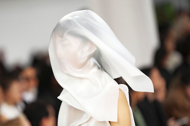 A model wears a creation as part of the Issey Miyake Spring/Summer 2025 collection presented Friday, September 27, 2024 in Paris. (Photo by Scott A Garfitt/Invision/AP Photo(