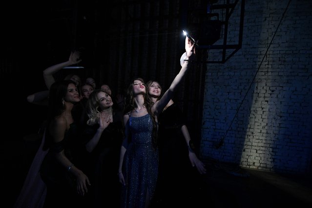 Participants take a selfie at the backstage of a contest “The Beauty of Donbass” in Donetsk, Russian-controlled Ukraine, on November 24, 2024, amid the Russia-Ukraine conflict. (Photo by AFP Photo/Stringer)