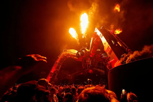 People enjoy their time near the Arcadia stage at the Glastonbury Festival site in Somerset, Britain on June 24, 2023. (Photo by Jason Cairnduff/Reuters)