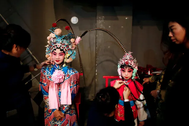 Participants prepare backstage during a traditional Chinese opera competition at the National Academy of Chinese Theatre Arts in Beijing, China, November 26, 2016. (Photo by Thomas Peter/Reuters)