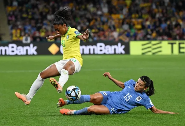 France's midfielder #15 Kenza Dali (R) tackles Brazil's midfielder #21 Kerolin (L) during the Australia and New Zealand 2023 Women's World Cup Group F football match between France and Brazil at Brisbane Stadium in Brisbane on July 29, 2023. (Photo by Dan Peled/Reuters)