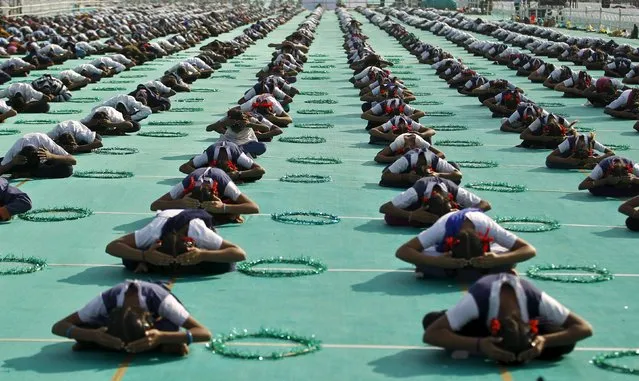 Schoolchildren attend a yoga session at a camp in Ahmedabad, India, January 9, 2016. (Photo by Amit Dave/Reuters)