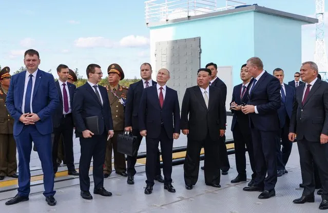 In this pool photo distributed by Sputnik agency, Russia's President Vladimir Putin (centre L) and North Korea's leader Kim Jong Un (centre R) visit the Vostochny Cosmodrome in Amur region on September 13, 2023. Russian President Vladimir Putin and North Korean leader Kim Jong Un both arrived at the Vostochny Cosmodrome in Russia's Far East, Russian news agencies reported on September 13, ahead of planned talks that could lead to a weapons deal. (Photo by Artem Geodakyan/Pool via AFP Photo)