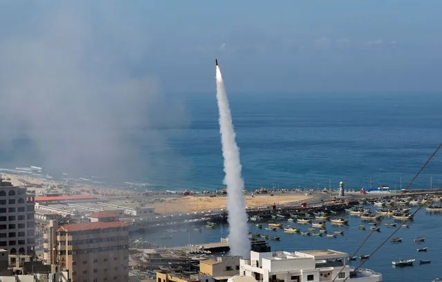 Rockets are fired by Palestinian militants into Israel, in Gaza City on October 7, 2023. (Photo by Mohammed Salem/Reuters)