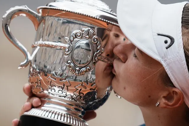 Czech Republic's Barbora Krejcikova kisses the trophy after defeating Russia's Anastasia Pavlyuchenkova during their final match of the French Open tennis tournament at the Roland Garros stadium Saturday, June 12, 2021 in Paris. The unseeded Czech player defeated Anastasia Pavlyuchenkova 6-1, 2-6, 6-4 in the final. (Photo by Thibault Camus/AP Photo)