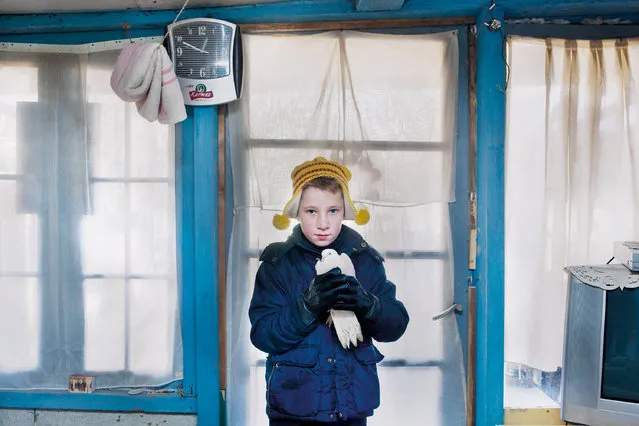 “Honorable Mention”. This picture is a part of the series of my work ‘Frumoasa’. "Frumoasa" is Romanian for 'beauty'. It's a work about Laurentiu and his family. They live in shacks next to the railway near the Ghent Dampoort. I met him and his family in December 2012. They have to deal with all kind of obstacles on a daily basis. Photo location: Ghent Dampoort Belgium. (Photo and caption by Aurélie Geurts/National Geographic Photo Contest)