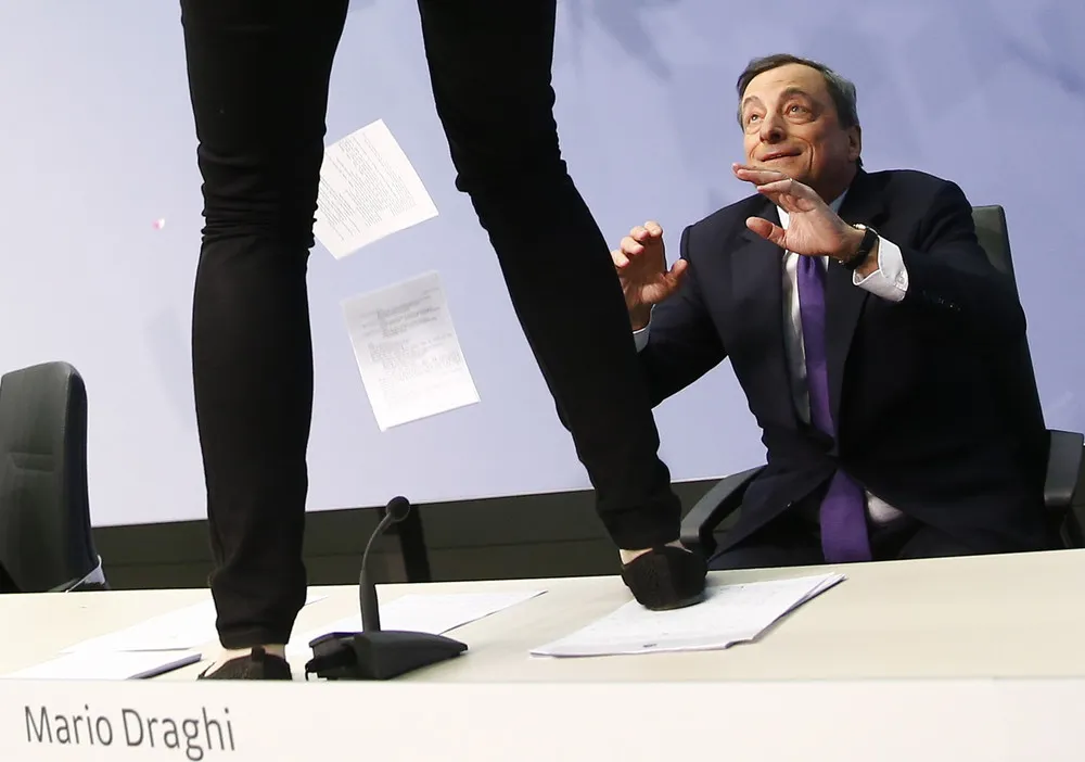Protester Jumps Mario Draghi