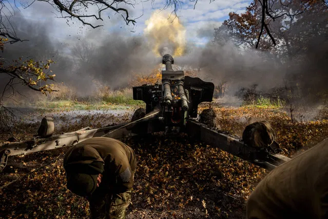 Ukrainian artillerymen fire a 152 mm towed gun-howitzer (D20) at a position on the front line near the town of Bakhmut, in eastern Ukraine's Donetsk region, on October 31, 2022, amid Russian invasion of Ukraine. (Photo by Dimitar Dilkoff/AFP Photo)