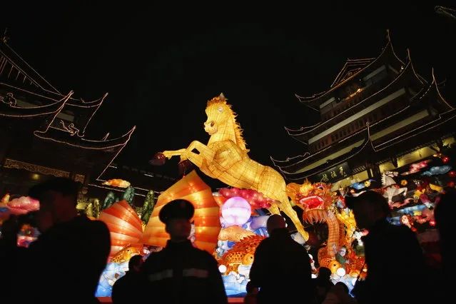 A giant lantern depicting a horse is seen among Chinese New Year decorations at Yuyuan Garden, in downtown Shanghai, January 25, 2014. (Photo by Carlos Barria/Reuters)