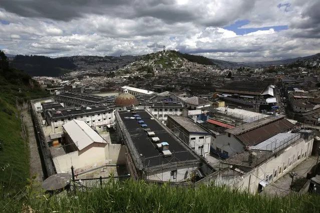 This April 9, 2015 photo shows the Garcia Moreno Prison, located in the middle of the capital city of Quito, Ecuador. The four-block-long building with numerous wings has been abandoned since September, when the 2,600 prisoners living in a space originally built for just 300 people were transferred to a larger and more modern penitentiary. (Photo by Dolores Ochoa/AP Photo)