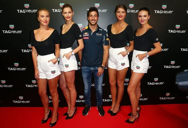 Red Bull Formula 1 Team driver Daniel Ricciardo poses with models at the TAG Heuer Grand Prix Party at Luminare on March 15, 2016 in Melbourne, Australia. The party was held to celebrate the new partnership between TAG Heuer and the Red Bull Racing Formula 1 Team. (Photo by Scott Barbour/Getty Images)
