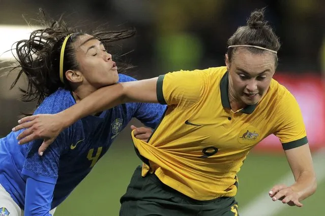 Australia's Caitlin Foord, right, competes against Brazil's Antonia Ronnycleide Da Costa Silva during their friendly soccer match in Sydney, Australia on Tuesday, October 26, 2021. (Photo by Rick Rycroft/AP Photo)