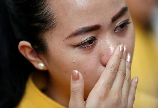 An employee of Jet Airways cries as she joins colleagues in a gathering to appeal to the government to save their company, in New Delhi, India, Thursday, April 18, 2019. Creditors of India's beleaguered Jet Airways say that they are “reasonably hopeful” that a bidding process with potential investors for a controlling stake in the airline will save the company. (Photo by Adnan Abidi/Reuters)