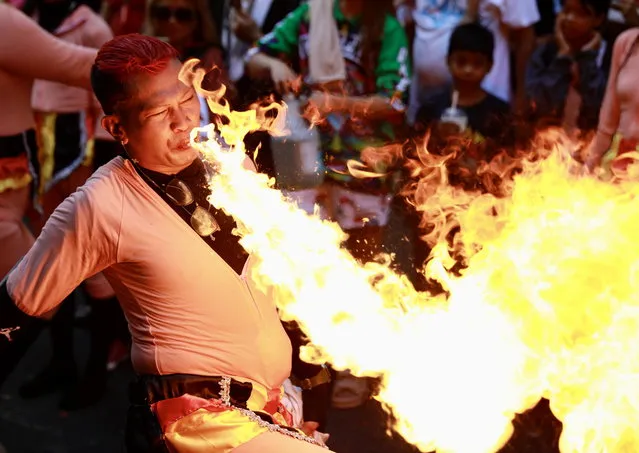 A Filipino dancer performs with fire to mark the Chinese Lunar New Year at Manila’s Chinatown in Manila, Philippines, 10 February 2024. The Chinese Lunar New Year, also called the Spring Festival, falls on 10 February 2024, marking the start of the Year of the Dragon. (Photo by Francis R. Malasig/EPA)