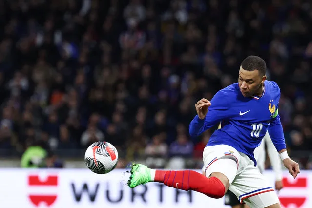 France's forward #10 Kylian Mbappe (C) flicks the ball during the friendly football match between France and Germany, at the Groupama Stadium in Decines-Charpieu, near Lyon, on March 23, 2024. (Photo by Franck Fife/AFP Photo)