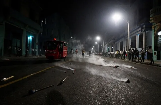 Smoking torches lie on the pavement after the March of Torches which is held annually in celebration of the birth anniversary of Cuba's independence hero Jose Marti, in Havana, Cuba on January 27, 2024. (Photo by Norly Perez/Reuters)