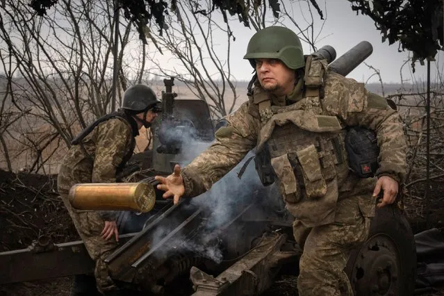 Ukrainian soldiers of the 71st Jaeger Brigade fire a M101 howitzer towards Russian positions at the frontline, near Avdiivka, Donetsk region, Ukraine, Friday, March 22, 2024. (Photo by Efrem Lukatsky/AP Photo)