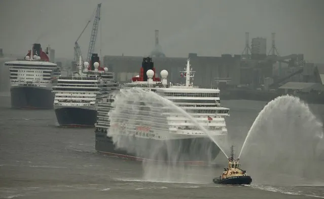 Three Cunard liners, (L-R)  Queen Mary 2, Queen Victoria and Queen Elizabeth arrive on the River Mersey in Liverpool, Britain May 25, 2015. The ships are in the city for the 175th anniversary of the Cunard cruise line. (Photo by Phil Noble/Reuters)