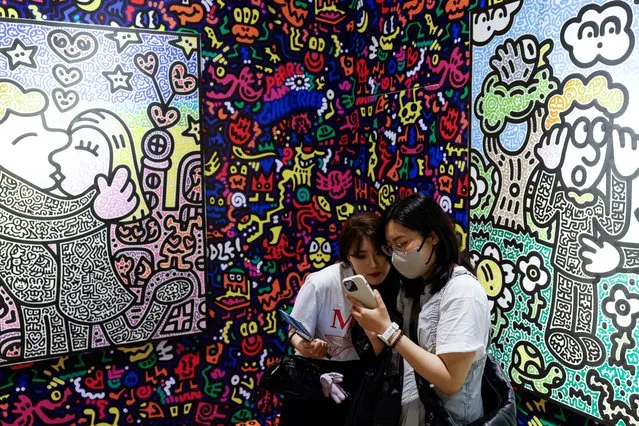 Artworks by Mr Doodle are displayed at Art Basel in Hong Kong, China on March 26, 2024. (Photo by Tyrone Siu/Reuters)