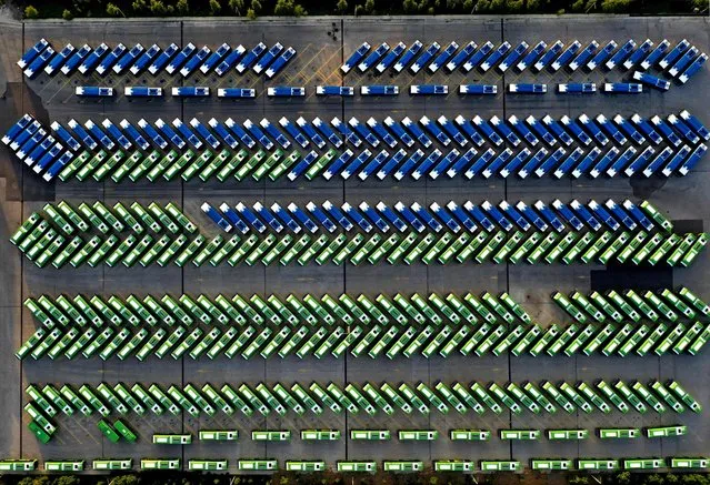 An aerial view shows city buses parked up in the bus depot following the suspension of public transport services amid concerns over the spread of the Covid-19 pandemic in Tbilisi on May 4, 2021. (Photo by Vano Shlamov/AFP Photo)