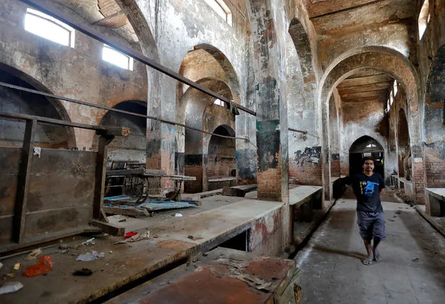 A man walks inside a closed mutton market in Lucknow, March 28, 2017. (Photo by Pawan Kumar/Reuters)