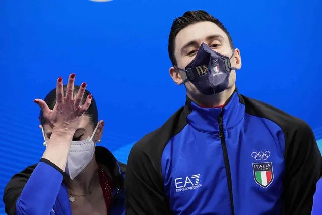Rebecca Ghilardi and Filippo Ambrosini, of Italy, react after the pairs short program during the figure skating competition at the 2022 Winter Olympics, Friday, February 18, 2022, in Beijing. (Photo by Bernat Armangue/AP Photo)