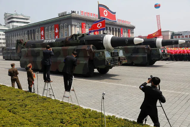 Missiles are driven past the stand with North Korean leader Kim Jong Un and other high ranking officials during a military parade marking the 105th birth anniversary of country's founding father Kim Il Sung, in Pyongyang April 15, 2017. (Photo by Damir Sagolj/Reuters)