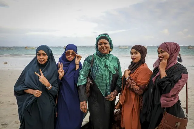 Somali Parliament member Fawzia Yusuf H. Adam, center, chats with campaign supporters at Lido beach in Mogadishu, Somalia Monday, July 19, 2021. The woman who broke barriers as the first female foreign minister and deputy prime minister in culturally conservative Somalia now aims for the country's top office as the country moves toward a long-delayed presidential election. (Photo by Farah Abdi Warsameh/AP Photo)